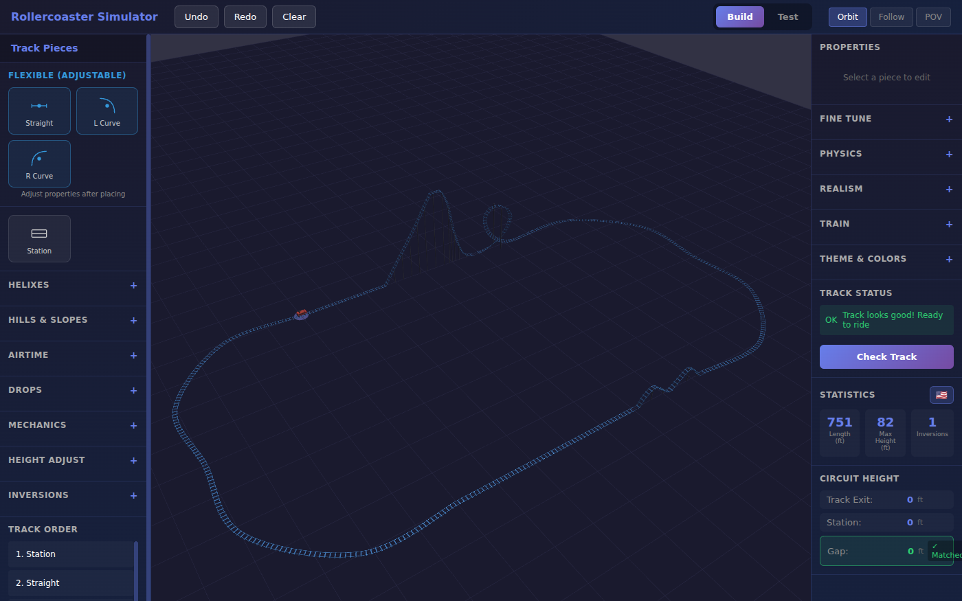 Rollercoaster Simulator in Build mode: a blue-railed coaster seen from above and to the side, with a tall chain lift, a steep drop into a vertical loop, two wide sweeping turns and a double hump on the return straight. A red train waits at the station. The right panel reads Track looks good, ready to ride, with statistics of 751 feet long, 82 feet high and one inversion.