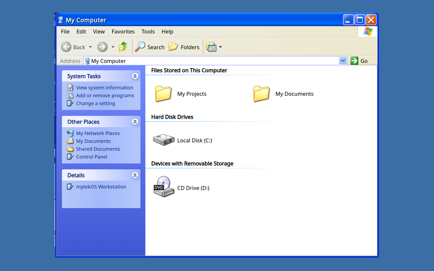 A Windows XP style My Computer window on a plain blue background, with a blue task pane down the left side, and My Projects, My Documents, Local Disk (C:) and a CD drive on the right. The Details box names the machine mytekOS Workstation.