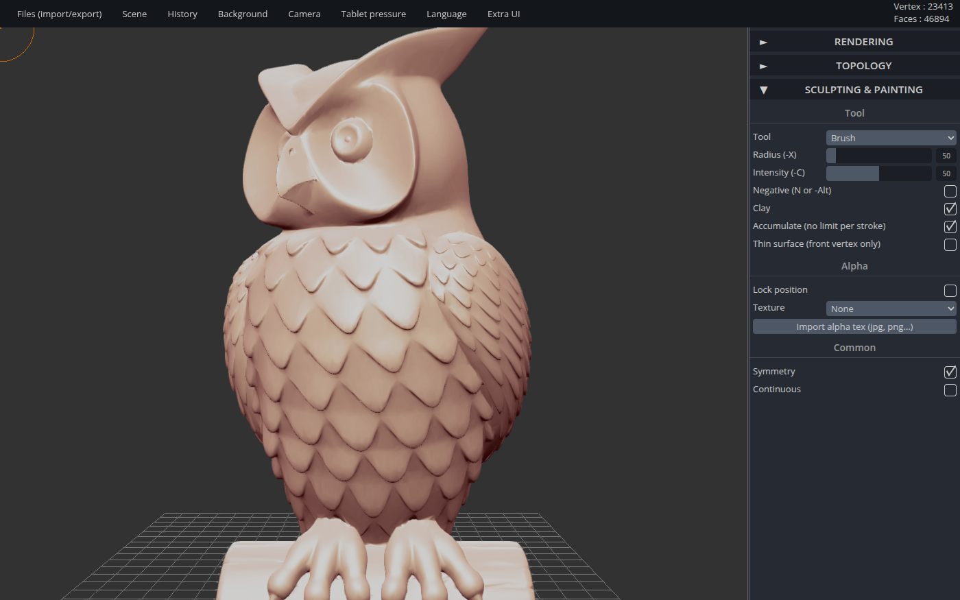 SculptGL showing a detailed clay-colored owl sculpture perched on a log, with large round eyes, a hooked beak, tufted ears and rows of scalloped feathers, standing on a grid floor. A menu bar runs along the top and a Sculpting and Painting panel on the right shows the Tool set to Brush with Radius, Intensity and Symmetry controls.